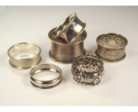 NAPKIN RINGS. Five various silver hallmarked napkin rings & an unmarked, waisted napkin ring.