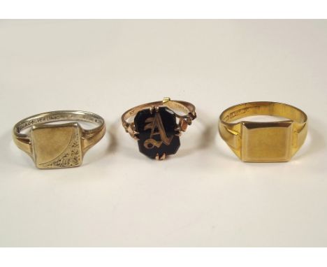 GOLD RINGS. A plain 9ct. gold signet ring, a 9ct. gold & onyx initial signet ring & one other 9ct. gold & silver lined signet