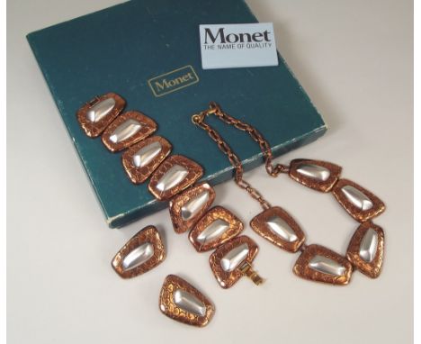 MONET. A suite of Monet anodised copper & aluminium jewellery, in original box with leaflet.