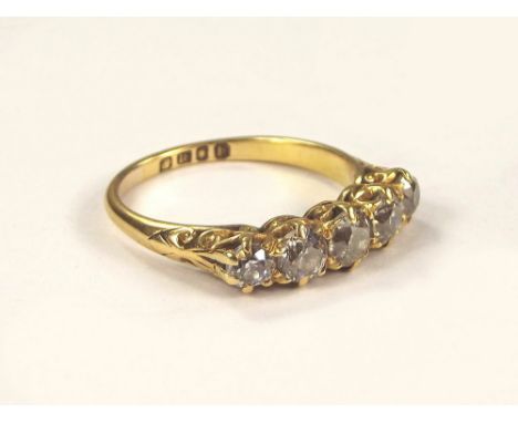 DIAMOND RING. An Edwardian 18ct. gold five stone diamond ring. Size Q. Approx. 4g.