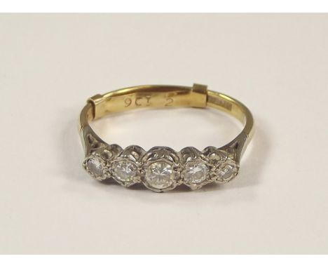 DIAMOND RING. An 18ct. gold & platinum, five stone diamond ring, with 9ct. gold spacer. Size with spacer Q/R.