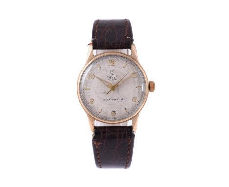 
	
		TUDOR, ROYAL
		A 9 CARAT GOLD WRISTWATCH, NO. 703774, CIRCA 1955
		Movement: Manual wind, 17 jewels
		Case: 9 carat gold