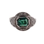 AN EMERALD AND DIAMOND DRESS RING