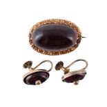A LATE 19TH CENTURY GARNET BROOCH AND A PAIR OF SIMILAR EARRINGS