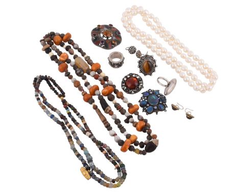 
	
		A COLLECTION OF SILVER COLOURED JEWELLERY AND COSTUME JEWELLERY 
		Three brooches: a lobed Scottish hardstone brooch, wi