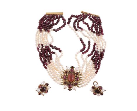 
	
		DIEGO PERCOSSI PAPI, A GARNET AND CULTURED PEARL NECKLACE AND EARRING SUITE 
		The central panel with an oval cabochon g