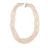 A THREE ROW CULTURED PEARL NECKLACE WITH DIAMOND CLASP