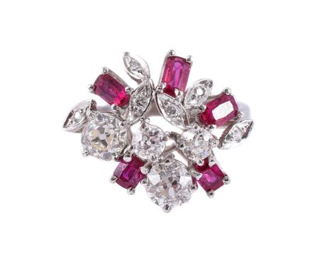 
	
		A RUBY AND DIAMOND DRESS RING
		The open cluster of old mine cut diamonds, eight cut diamonds in marquise shaped setting