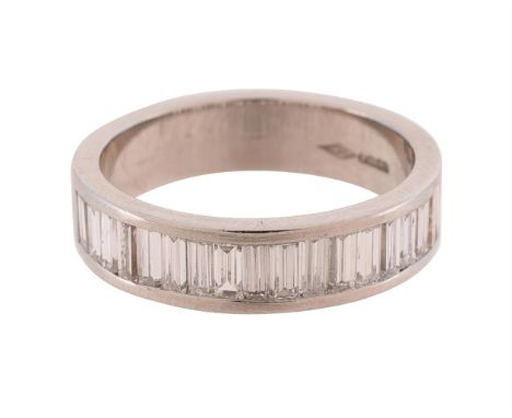 
	
		A DIAMOND HALF ETERNITY RING 
		LONDON 2014
		The platinum band channel set with baguette cut diamonds, approximately 2.