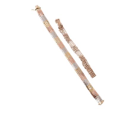 
	
		TWO FANCY LINK BRACELETS
		The first of gate link design, stamped 375; the second of engraved tri-colour 9ct gold linkin