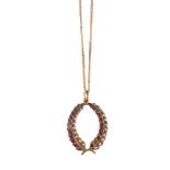 AN EARLY 20TH CENTURY RUBY AND SEED PEARL WREATH PENDANT