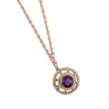 AN EARLY 20TH CENTURY AMETHYST, DEMANTOID GARNET AND SPLIT PEARL SUFFRAGETTE BROOCH/PENDANT