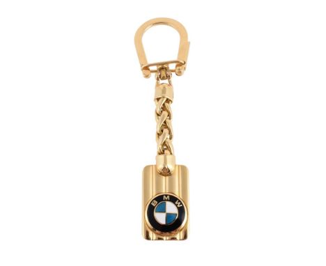 
	
		AN ITALIAN BMW KEY RING 
		The rectangular panel with applied enamelled BMW insignia, suspended from a chevron link chai