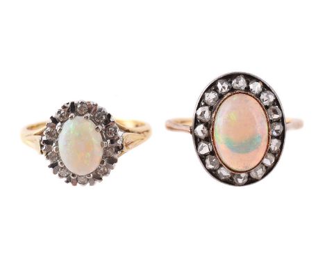 
	
		TWO OPAL AND DIAMOND CLUSTER RINGS
		The first with an oval cabochon opal within a brilliant cut diamond and baton surro