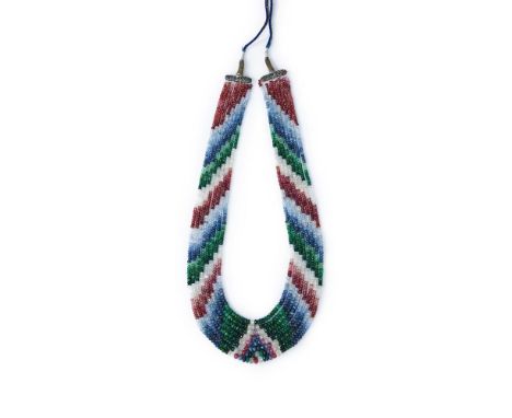 
	
		AN EARLY 20TH CENTURY SAPPHIRE, RUBY AND EMERALD BEAD NECKLACE
		Composed of eight graduated strands of alternating face