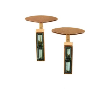
	
		A PAIR OF GREEN TOURMALINE CUFFLINKS  
		The baton shaped panels set with two step cut green tourmalines, to matt finish