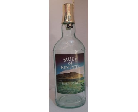 Empty Bottle of Mull Of Kintyre Scotch Whiskey label reads Distilled at Campbeltown Scotland, Refined at Abbey Road London, A