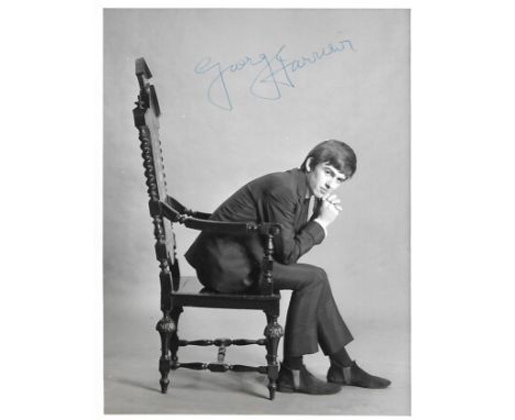 Astrid Kirchherr photograph of George Harrison sold at NEMS Liverpool signature on the front is by Neil Aspinall. The item is