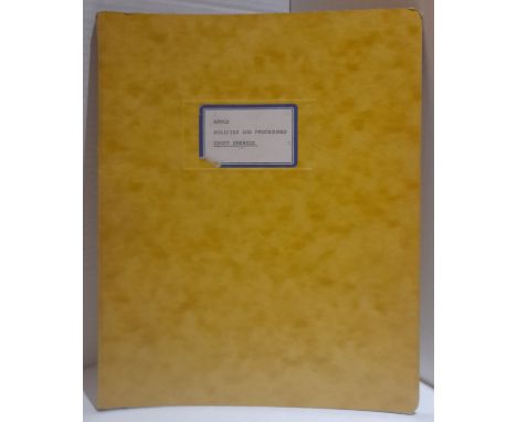 Yellow Ring Binder with sticker on front Apple Policies and Procedures Geoff Emerick 