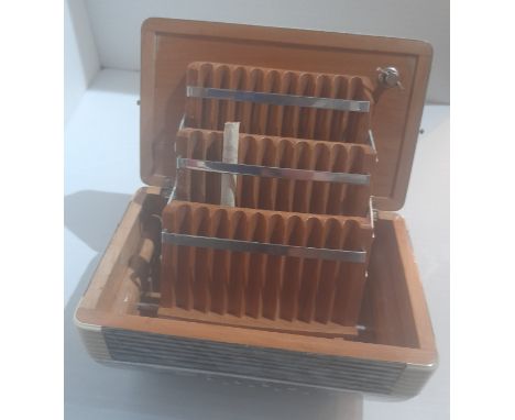 An accordion cigarette case and silver dish formerly the property of Beatles Recording Engineer Geoff Emerick. 