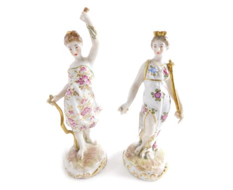 A pair of Meissen porcelain classical figures of ladies, the first holding staff with her arm in the air, polychrome decorate