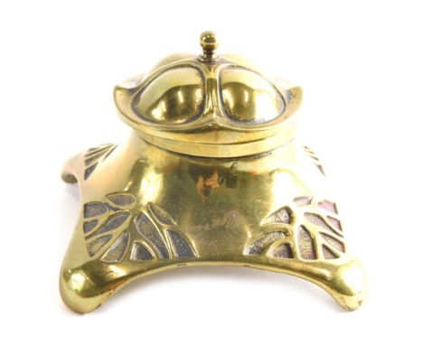 An Art Nouveau style crown topped brass inkwell, unmarked, 9cm wide.