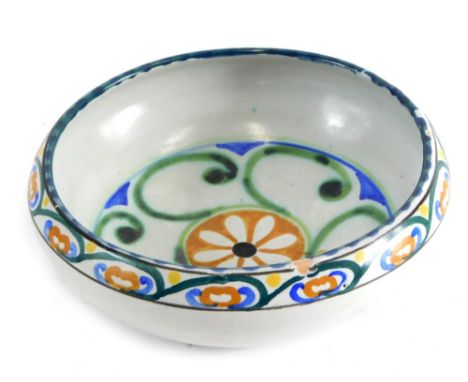 An early 20thC Collard Honiton Poole style bowl, decorated with flowers, impressed marks beneath, 16cm diameter.
