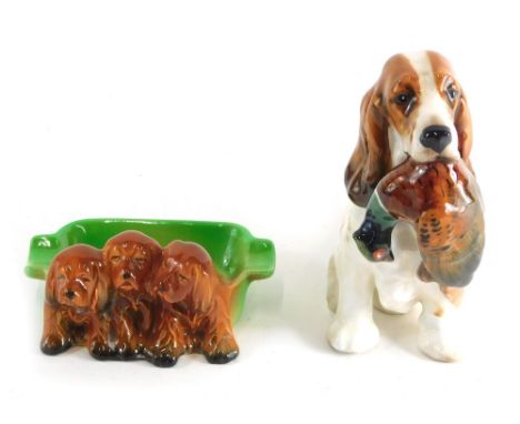 A Royal Doulton figure group gun dog and pheasant, number 1028, printed marks beneath, 15cm high, and a Beswick puppy dish, n