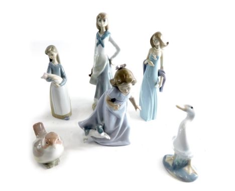 A Lladro figure group of a child holding piglet, 19cm high, and various other Lladro, Nao and other similar figures, various 