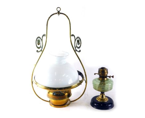 A brass hanging lantern lamp, with milk glass shade, 71cm high, and a glass oil lamp. 