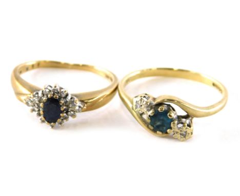 Two dress rings, comprising of a 9ct gold aquamarine and diamond twist ring, ring size N½ and a 9ct gold sapphire and diamond