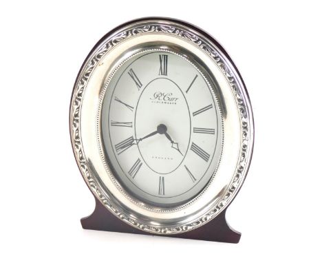 An Elizabeth II silver fronted mantel clock, marked R Carr Clock Makers, with 8cm wide paper dial printed with Roman numerals