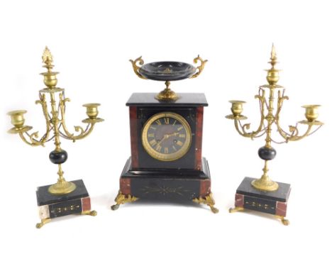 A 19thC black slate and red marble clock garniture, comprising mantel clock, the 10cm diameter Roman numeric dial surmounted 