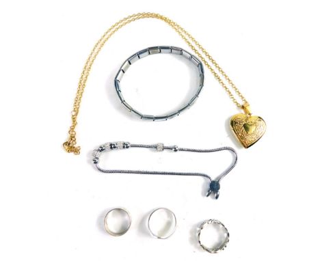 A silver signet ring, size P, pierced band, textured silver band, heart shaped locket, attached to slender link chain, a brac
