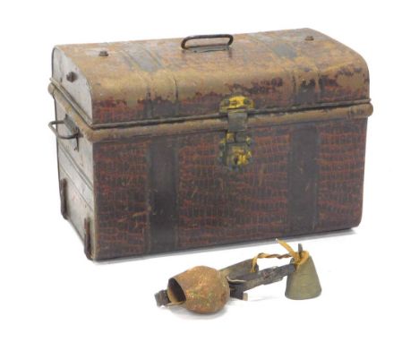 An early 20thC domed top tin trunk, with shaped carrying handles, 35cm high, 59cm wide, 38cm deep. 