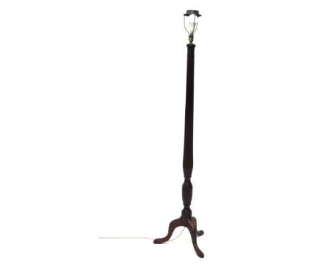 A 20thC mahogany standard lamp, with acanthus leaf carving above a reeded stem, on triple cabriole legs, 189cm high. 