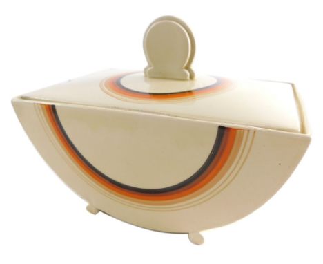 A 1930's Clarice Cliff Bizarre Biarritz jar and cover, with a line decoration printed predominately in orange, cream and brow