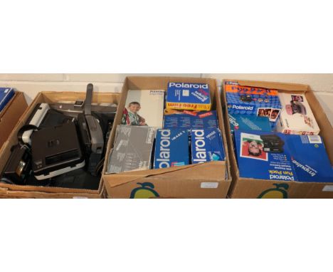 Three boxes of Polaroid cameras 