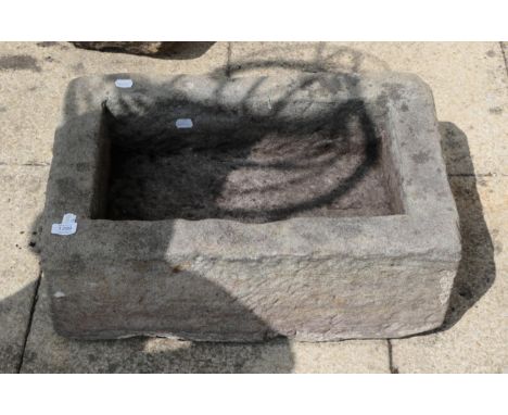 A rectangular stone garden trough, 63cm wide 