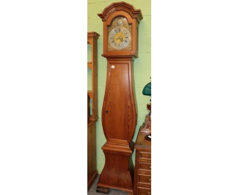 ^ A Continental pine striking longcase clock