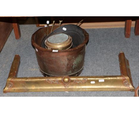 A Victorian brass fire curb; a copper coal bucket; brass fire irons; coal helmet etc 