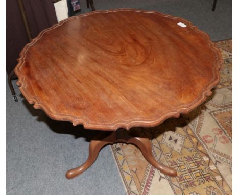A 19th century mahogany piecrust top tripod table 
