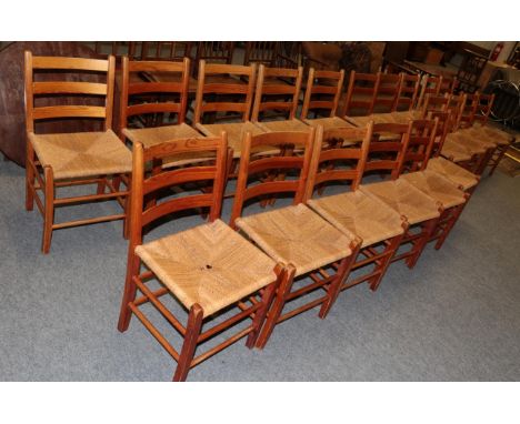 Twenty pine rope work seated ladder back chairs   