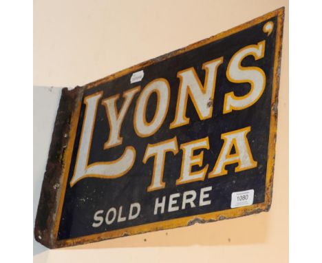 ^ A double sided enamel advertising sign with mounting flange ''Lyons Tea Sold Here'', 30cm by 45cm 