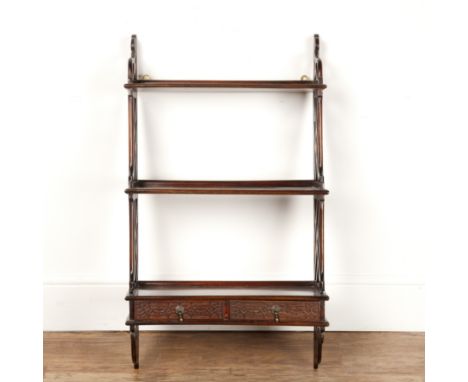 Three-tier mahogany wall shelf 18th Century style, fitted with two blind fretwork frieze drawers, 51cm wide  At present, ther
