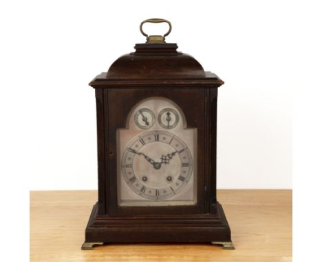 Winterhalder and Hofmeier bracket clock in mahogany inverted bell top case, with pierced side panels, the silvered dial with 