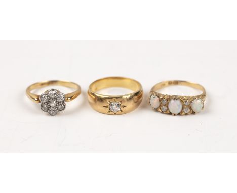 Three gold rings comprising a yellow metal diamond floral cluster ring, size L, 3g approx overall, an 18ct diamond ring, with