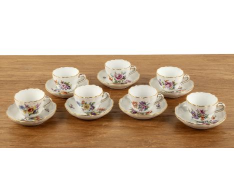 Meissen painted coffee setGerman, painted with flower sprays,including seven coffee cups and six saucers  With signs of wear 