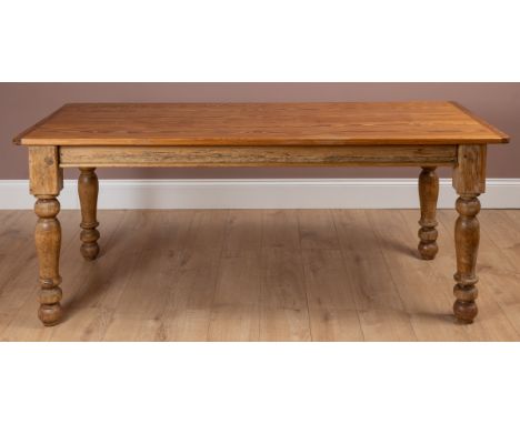 Pine kitchen tablewith turned legs and a later top, 183cm wide x 81cm deep x 75cm high  A notable patch in the top covering a