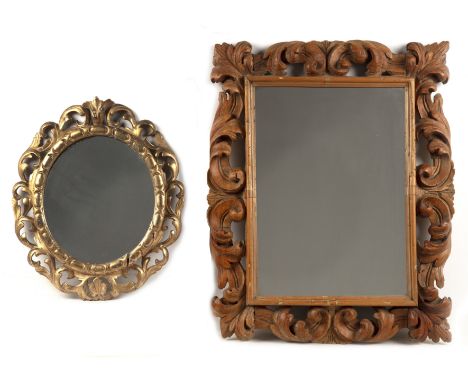 Two carved mirrors19th Century, the first Florentine style, gilded and of oval form, the frame carved with recurring crescent